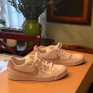 Womens Nike Sneaker with Pink Swoosh.